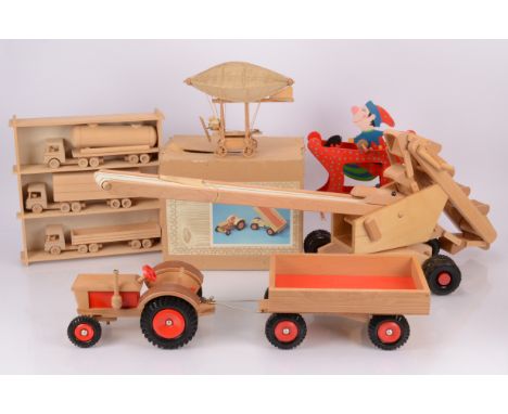 Large Collection of unpainted and painted wooden Toys,  unpainted, three Articulated Trucks, in shelf unit, Village in a box,