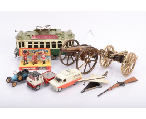 Various Toys and Models by Dinky Corgi Britains Metal Cannons and Asian metal Tram, Dinky Toys Police white and orange  Ford 