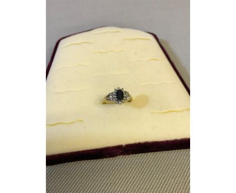 9CT Gold ladies ring set with sapphire and diamonds. 2.29grams 