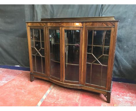 Antique 1900's mahogany display cabinet styled with bow front double glass doors and two side glass doors, Fitted with interi