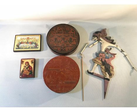 A mixed lot to include two religious plaque icons, two Chinese lacquered lidded compartment boxes and an Asian puppet 
