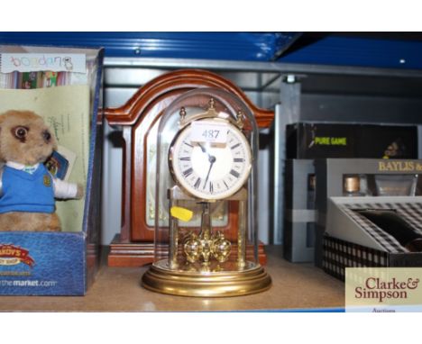 A Tempest Fugit Westminster chime mantel clock together with an anniversary clock