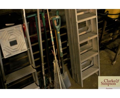 A quantity of long handled gardening tools 