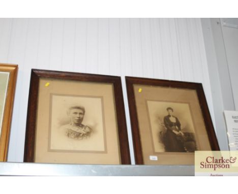Two oak framed black and white portrait prints 
