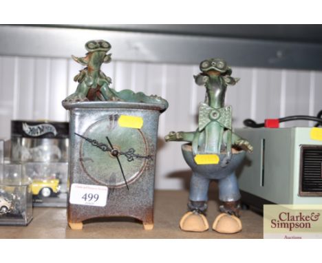 A pottery ornament with similar mantel clock 