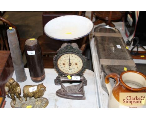 A set of scales together with a flat iron 