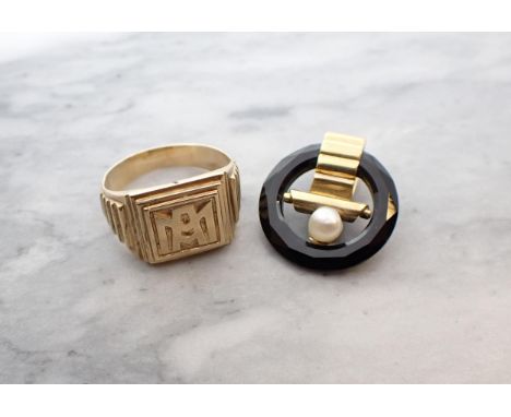 An square Signet Ring embossed monogram, ring size M, approx 7.20gms and an Onyx and Cultured Pearl Tie Clip 