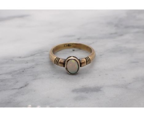 An Opal Ring rubover-set oval stone in 18ct gold, ring size Q, approx 5gms 