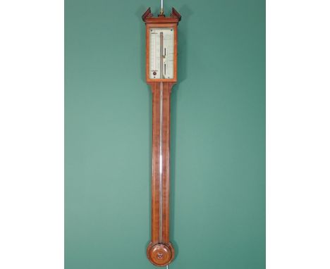 A George III mahogany and satinwood strung Stick Barometer with broken arch pediment, acorn finial and silvered dial, by Mero