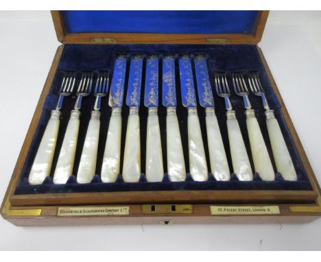 Six Edward VII Dessert Knives and Forks with engraved blades, mother of pearl hafts, London 1901, in case, makers: Goldsmiths