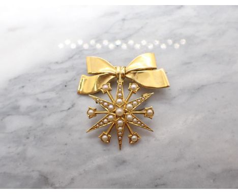 A Victorian Seed Pearl Star Brooch stamped 15ct suspended from later 9ct gold bow brooch. Diameter of star 30mm. 