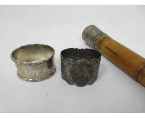 Two silver Napkin Rings with engraved decoration and initials, Sheffield 1899 and London 1911, one cased, and a white metal t