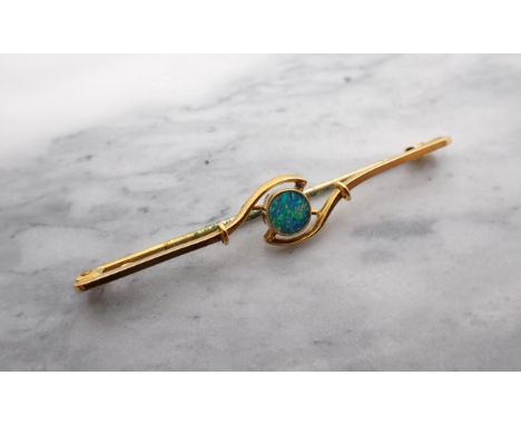 An Opal Doublet Bar Brooch millegrain set round stone stamped 9ct. 55mm w. 