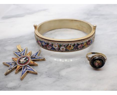 A Continental micro-mosaic hinged Bangle the front with bouquets of polychrome flowers the reverse with forget-me-nots on gil