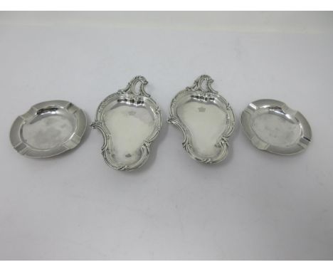 A pair of Victorian silver rococo Dishes engraved crown crests, scroll pierced handles on ball feet, Birmingham 1893, and a p