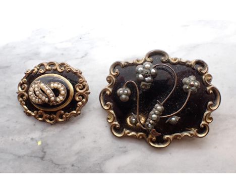 Two Victorian Black Enamel and Seed Pearl Mourning Brooches on yellow metal. 50mm and 32mm w. Both A/F. 