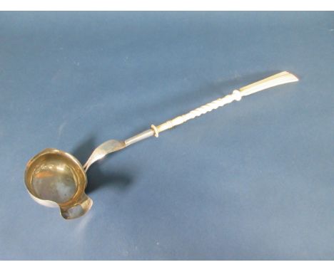 A Continental silver Ladle with engraved stem and bone handle, maker: W. Giese, A/F 