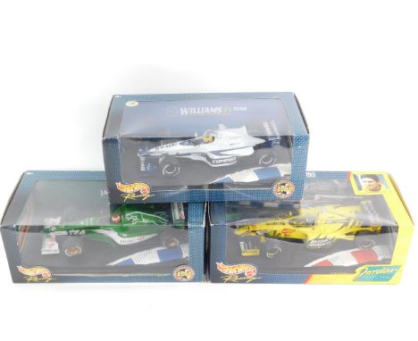 Three Hotwheels racing cars, scale 1:18, comprising Williams F1 Team, FW22 Ralf Schumacher, Jordan 199, Damon Hill, and Jagua