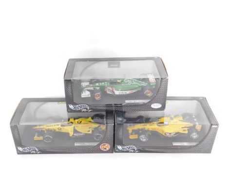 Three Hotwheels models of racing cars, scale 1:18, comprising Jaguar Racing R2, Pedro Del La Rosa, 2001; Jordan EJ13 Gian Car