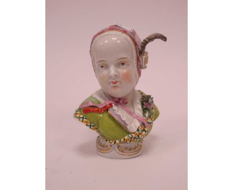 A German Late XIX Century Porcelain Bust of a Young Lady, wearing a feather bonnet, green blouse and checked sash, raised on 