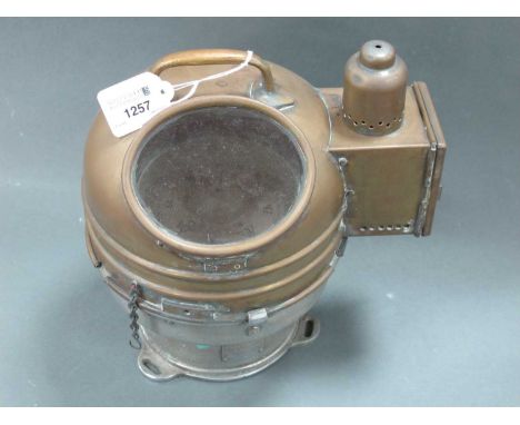 An Early XX Century Ship's Binnacle Compass, in brass surround, the dome top with handle and side fitting for a lamp, patent 
