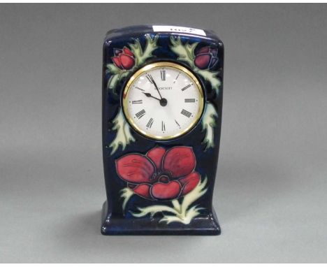 A Moorcroft Pottery Mantle Clock, painted in the 'Anemone' pattern, 15.5cm high.some pitting to case