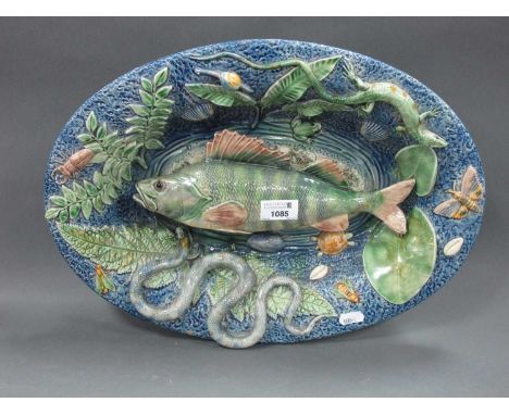 A Late XIX Century Palissy Style Pottery Oval Dish, encrusted with fish, snakes, insects, foliage, etc, 43cm long.crackle to 