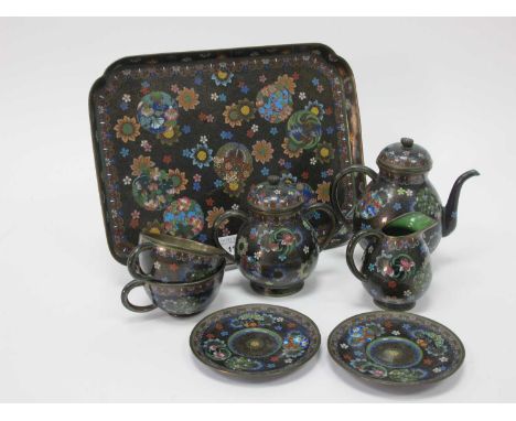 An Early XX Century Japanese Cloisonné Cabaret Set, profusely decorated with flowers and butterflies, comprising: a shaped re