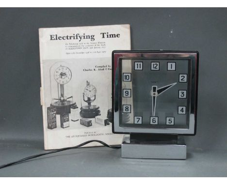 A Smith Electric Bakelite and Chrome Cased Art Deco Mantle Clock, the square perspex dial with Arabic numerals upon a rectang