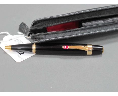 A Mont Blanc Ballpoint Pen, the black and gilt case set with ruby coloured stone, with a leather Mont Blanc pen case.