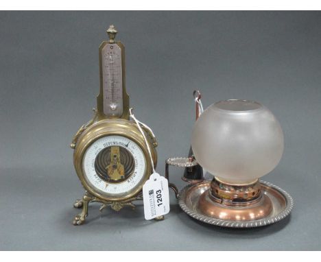 An Early XX Century Russian Brass Cased Thermometer/Barometer, raised on four paw feet with foliate scrollwork, 20cm high and
