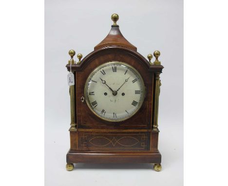 An Early XIX Century Bracket Clock, the mahogany and satinwood inlaid case with arched top with brass ball surmount, the side