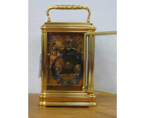 A Good Quality Brass Repeating Carriage Clock, retailed by J.W. Benson, 25 Old Bond St, London, the white enamel dial with Ro