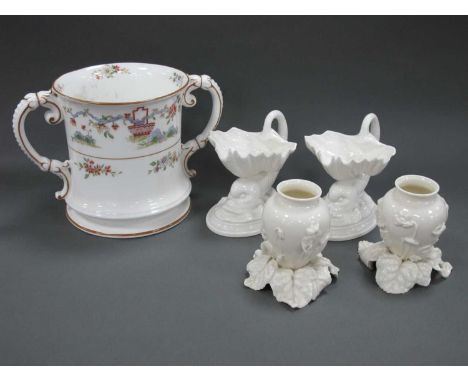 A Royal Worcester Porcelain Two-Handled Loving Mug, decorated with a Chinoiserie design of urns of flowers and shrubs, painte
