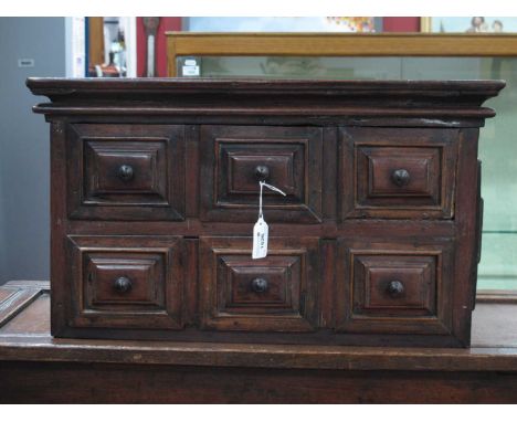 A Late XVII/Early XVIII Century Continental Table Top Cabinet, possibly walnut, with moulded front drawers and raised panel s