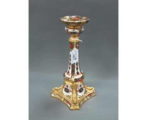 A Royal Crown Derby Candlestick, decorated in Imari pattern 1128, the tapered column raised on shaped square base with moulde