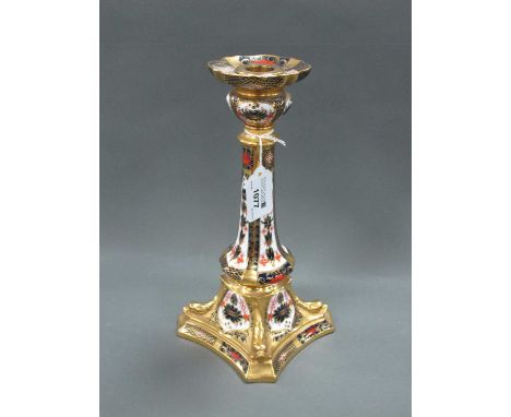 A Royal Crown Derby Candlestick, decorated in Imari pattern 1128, the tapered column raised on shaped square base with moulde