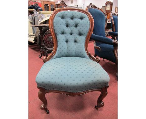 A XIX Century Mahogany Nursing Chair, with button back upholstery, serpentine front rail on cabriole legs.