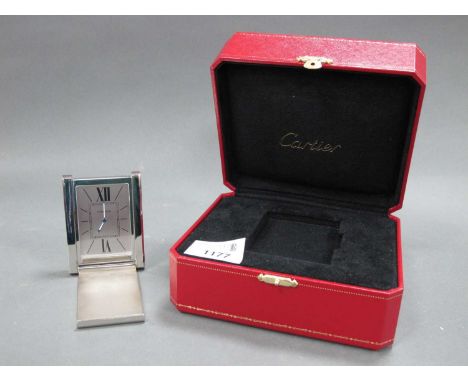 A Cartier Stainless Steel Bedside Clock, of rectangular fol-out form, the dial with Roman numerals and black enamel cover wit