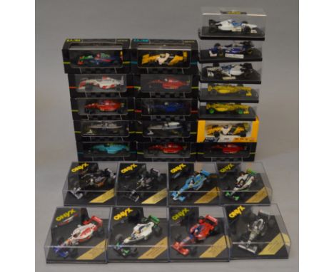 Twenty four boxed Onyx diecast F1 Racing Car models in 1:43 scale including #126 from the '91 F1 Collection 'Tyrrel Honda 020