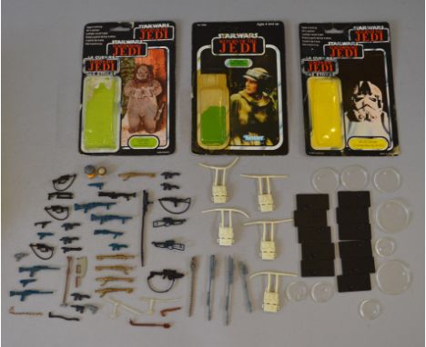 Quantity of Kenner Star Wars weapons and accessories. Together with three action figure backing cards.