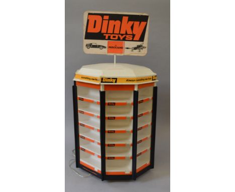 An unboxed empty Dinky Toys revolving counter display stand with internal light, capable of holding forty eight models, appea
