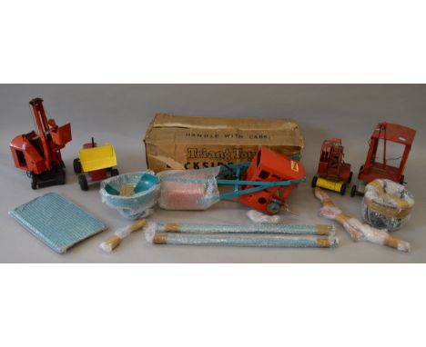 A group of unboxed Tri-ang Pressed Steel Crane toys including a boxed free standing Dockside Crane, overall appears G+ in P/F