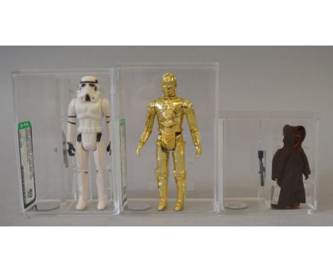 Three Kenner Star Wars 3 3/4 action figures, all AFA graded: C-3PO, AFA 85; Stormtrooper, AFA 80; Jawa, AFA 85. (3)