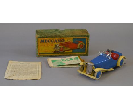 A boxed Meccano Two Seater Sports Car with clockwork motor. The non constructional version of this model in blue and cream wi