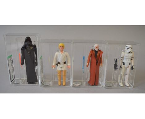 Four Kenner Star Wars 3 3/4 action figures, all AFA graded: Luke Skywalker, AFA 80; Darth Vader, AFA 80+; Stormtrooper, AFA 8
