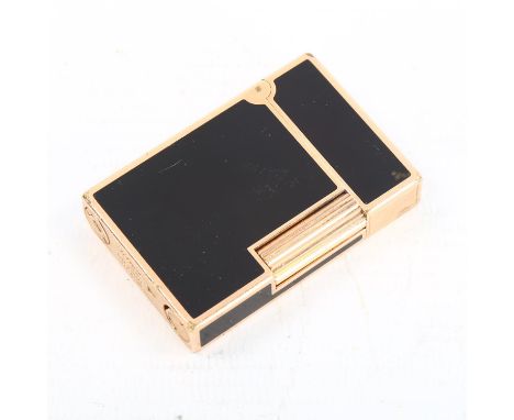 DUPONT - a gold plated and black enamel pocket lighter, length 5.5cm 