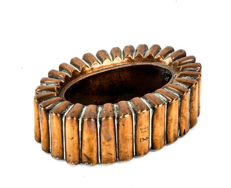 A large Victorian copper jelly mould, overall fluted form with open centre, no maker's marks, model no. 4877, length 24cm, he