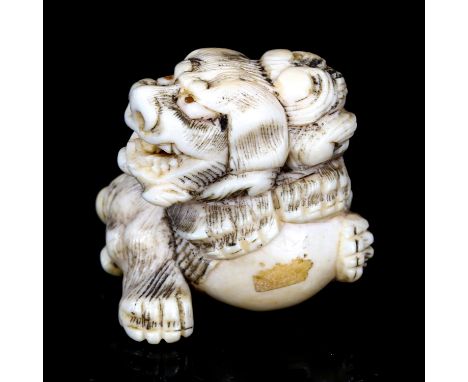 A Japanese carved ivory netsuke in the form of a dragon, Meiji Period, height 3.5cm 