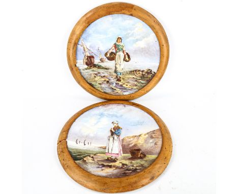 A pair of large 19th century French ceramic wall plates, with hand painted designs of fisher girls, signed A Delus, mounted i